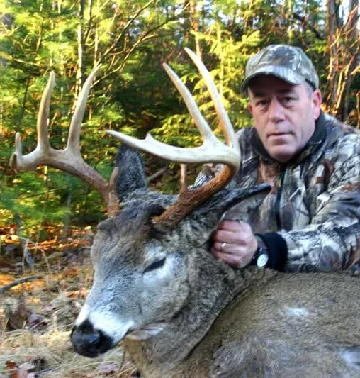 Rick Gonsalves and havested whitetail deer in Maine, 2009.